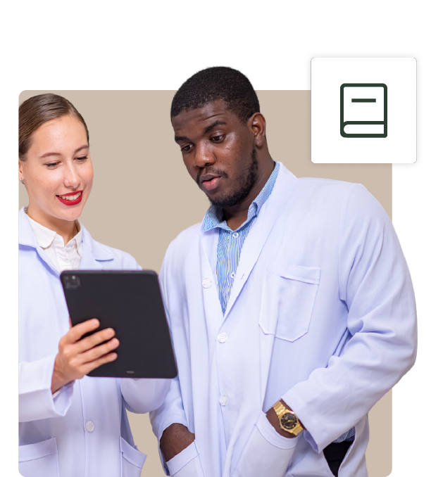 Two healthcare professionals analyzing data on a tablet.